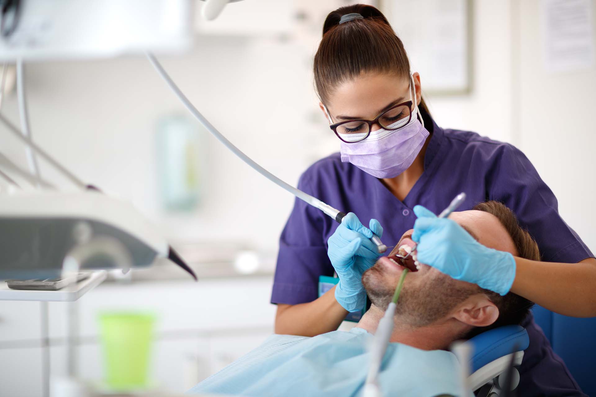 A woman dentist working on a patient