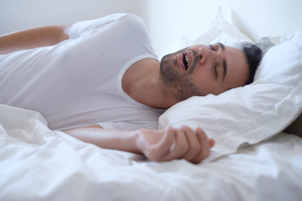 A man snoring during sleep