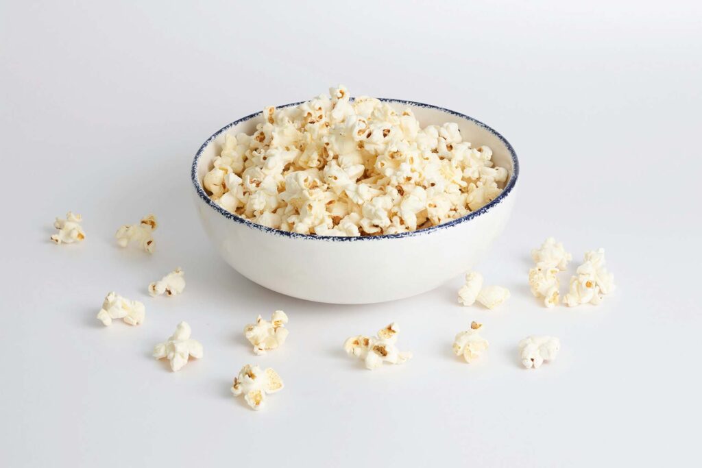 A white bowl with popcorn